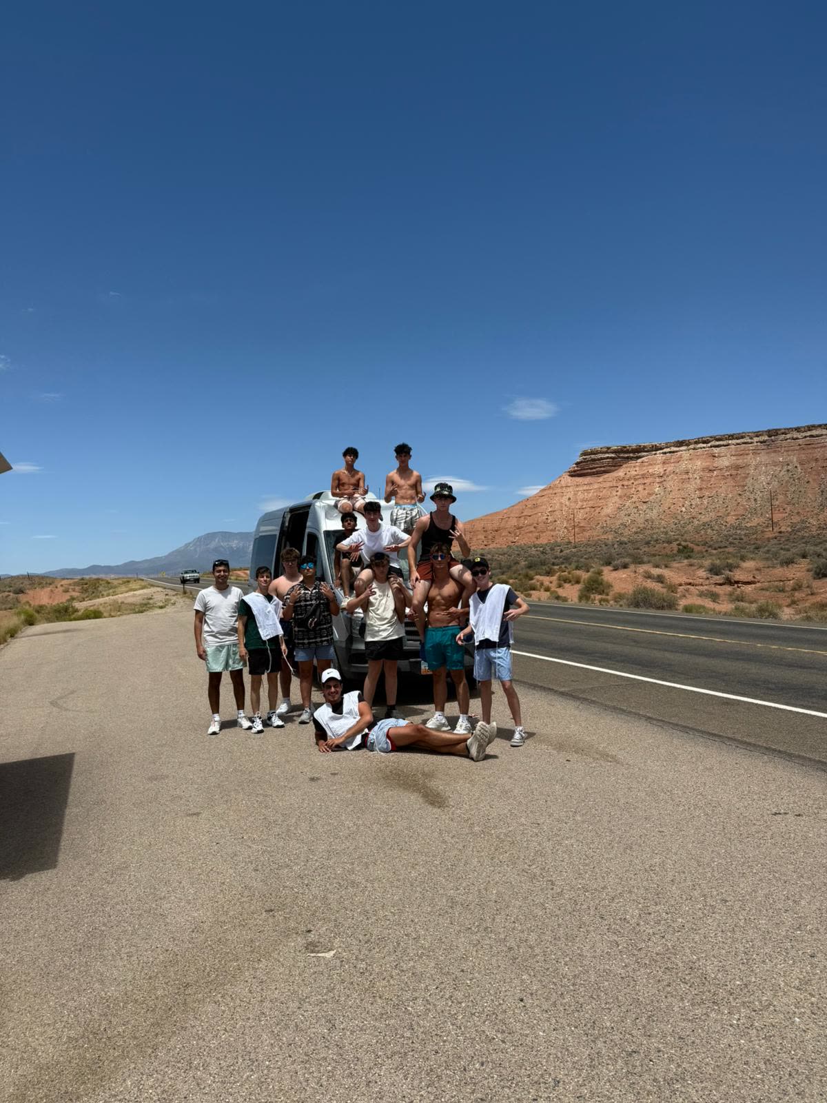 Desert highway with red rock formations