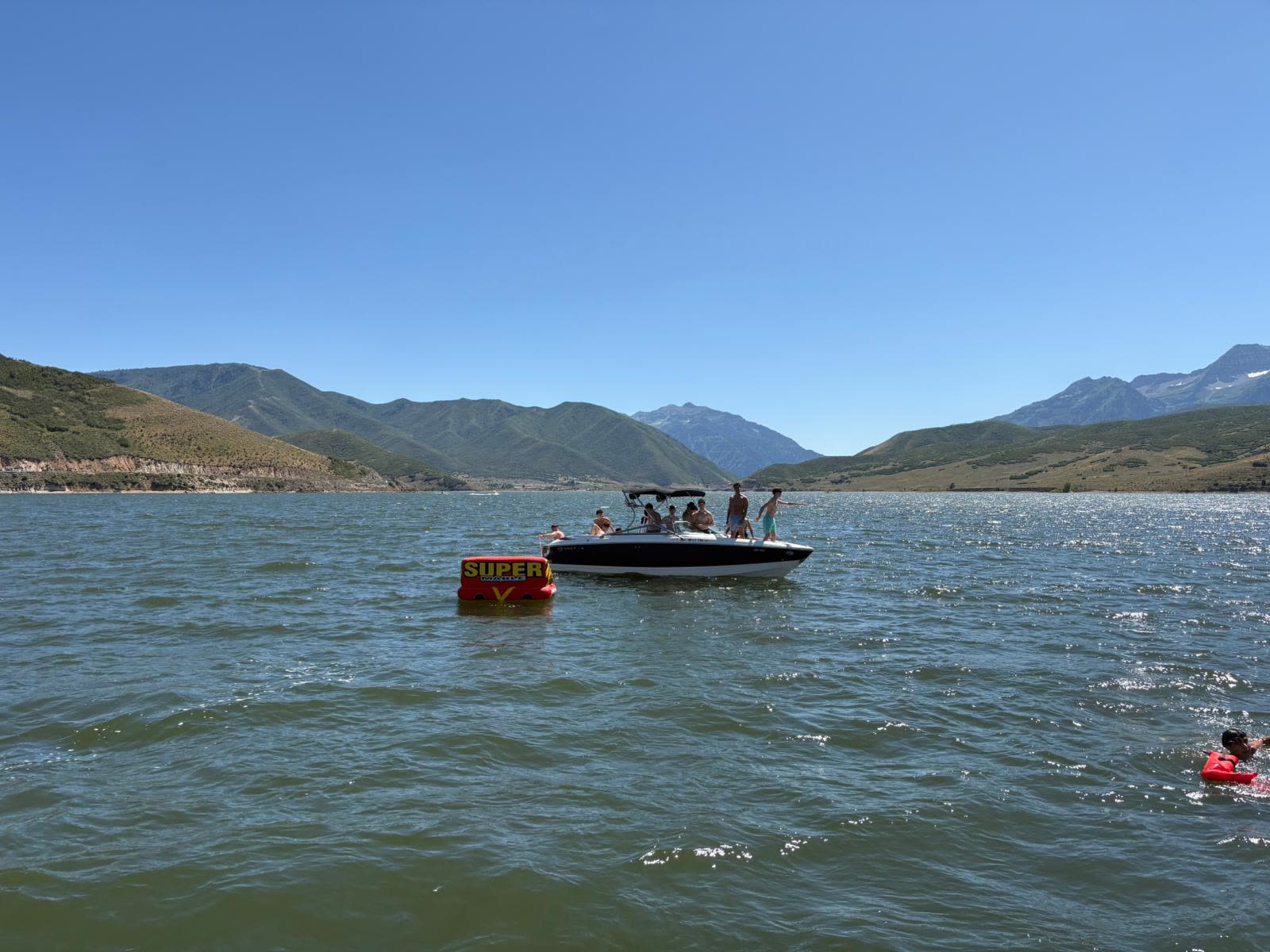 Guys on a boat on a mountain lake