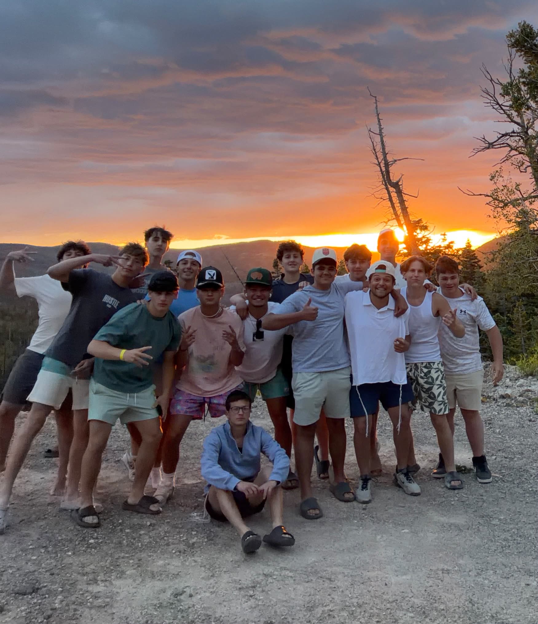 Group at a mountain overlook at sunset
